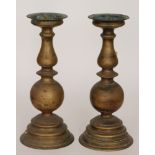 A pair of 20th Century brass pricket candlesticks on stepped circular bases,