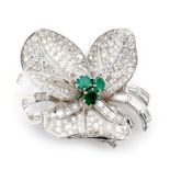 A modern platinum white gold emerald and diamond flower brooch designed with three curled petals,