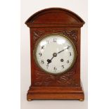 An Edwardian mahogany cased mantle clock with eight day striking movement on a gong,