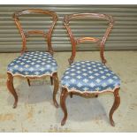 A set of six Victorian carved rosewood salon chairs,