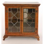 A 20th Century miniature crossbanded mahogany apprentice cabinet in the Chippendale style,