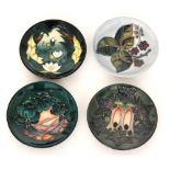 Four assorted Moorcroft Pottery pin dish coasters comprising one in the Lamia pattern designed by