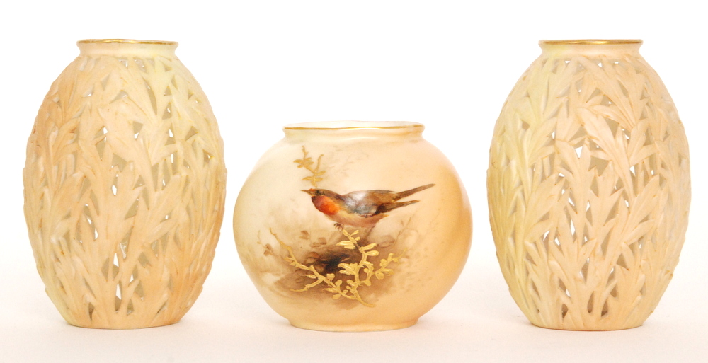 A Royal Worcester shape G161 ovoid vase decorated with a hand painted robin perched on a gilt