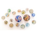 A collection of eighteen hand blown late 19th to early 20th Century marbles,