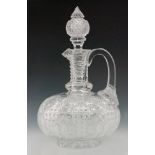 A late 19th Century Stevens & Williams clear crystal glass claret jug of squat globe and shaft form