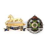 An 18ct West Yorkshire Regiment brooch of a horse above West Yorkshire picked out in blue enamel,