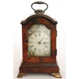 A 19th Century mahogany cased miniature bracket clock with painted arch dial and spring driven