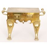 A 19th Century two handled brass footman on paw feet below two fixed faux drawers,