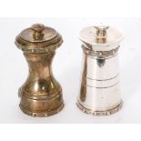 A hallmarked silver pepper grinder in the form of a milk churn and another similar example,