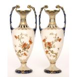 A pair of Austrian Ernst Wahliss Turn Teplitz pedestal vases decorated to the bodies with hand