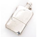 A hallmarked silver hip flask of plain rectangular form terminating in hinged bayonet cap,