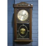 A 19th Century mahogany framed circular wall clock with thirty hour spring driven movement and a