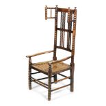 A 19th Century Northern Counties ash bobbin turned elbow chair with woven cane seat.