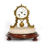 A 19th Century brass mantle clock with eight day movement striking on a bell in a glass dome,