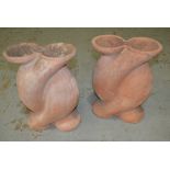 A pair of contemporary terracotta wrythen shaped garden pots, height 49cm.