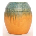 A Ruskin Pottery vase of ovoid form with an inverted collar decorated in a mottled blue to orange,