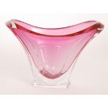 A post war Val St Lambert glass vase of compressed flared form cased in clear crystal over magenta,