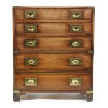 A small 20th Century brass cornered mahogany military style chest of four drawers on bracket feet,