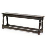 An 18th Century oak long bench,