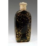 A mid 18th Century green glass scent bottle of facet cut form hand gilded in the manner of James