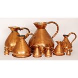A matched set of nine graduated copper ale jugs some stamped Sollom & Sons Wolverhampton,
