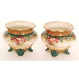A pair of late 19th Century Hadley's Worcester table salts each of lobed form raised to four scroll