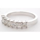 An 18ct white gold diamond seven stone half eternity ring,