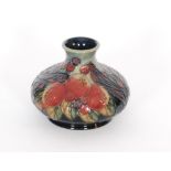 A Moorcroft Pottery vase of compressed form decorated in the Finches pattern designed by Sally