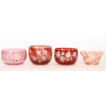A composed pair of late 19th Century Bohemian glass finger bowls flashed in ruby over clear and