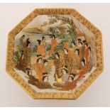 A late 19th Century Japanese Satsuma footed octagonal bowl decorated with ladies in a mountainous