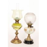 An Edwardian brass oil lamp with vaseline glass shade on circular ribband base, height 53cm,