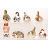 Eight assorted Royal Crown Derby paperweights comprising five small birds and three Collectors