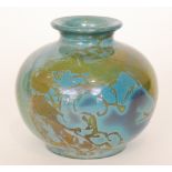 A post war studio pottery vase of compressed ovoid form decorated with lustre brush strokes over a