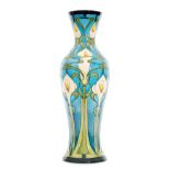 A large Moorcroft Pottery Prestige vase decorated in the Calla Lily pattern designed by Emma