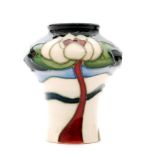 A miniature Moorcroft Pottery vase decorated in the Flower of Victoria pattern designed by Rachel