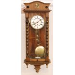 A late 19th Century eight day, sprung driven wall clock,