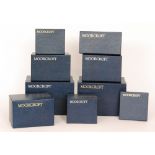 A large collection of assorted empty Moorcroft blue cardboard boxes.