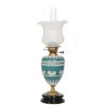 A Victorian Jasperware slate blue brass oil lamp and shade decorated with Romanesque chariots and