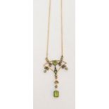 A peridot and diamond openwork pendant,