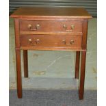 A Georgian style mahogany side table, fitted with two frieze drawers above block chamfered legs,
