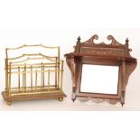 An Edwardian brass two divisioned magazine rack on an oak base, width 35cm,