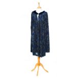 A 1920s ladies vintage cape in blue chiffon with a matching blue velvet rim and collar,