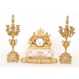 A 19th Century gilt metal clock garniture mounted with two figures and a pair of candelabras on