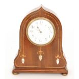 An Edwardian chequer strung mahogany mantle clock with mother of pearl and satinwood inlaid detail,