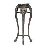 An early 20th Century Oriental export carved hardwood jardiniere stand of circular form,