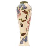 A Moorcroft Pottery vase decorated in the Floral Swing pattern designed by Paul Hilditch,