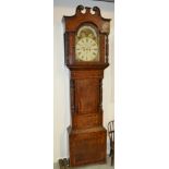 A 19th Century mahogany cross-banded longcase clock with an eight day movement striking on a bell,