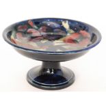 A 1930s William Moorcroft pedestal comport decorated in the Pansy pattern,