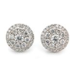 A modern pair of 18ct diamond cluster earrings,
