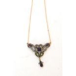 An Edwardian style amethyst, peridot and seed pearl openwork pendant,